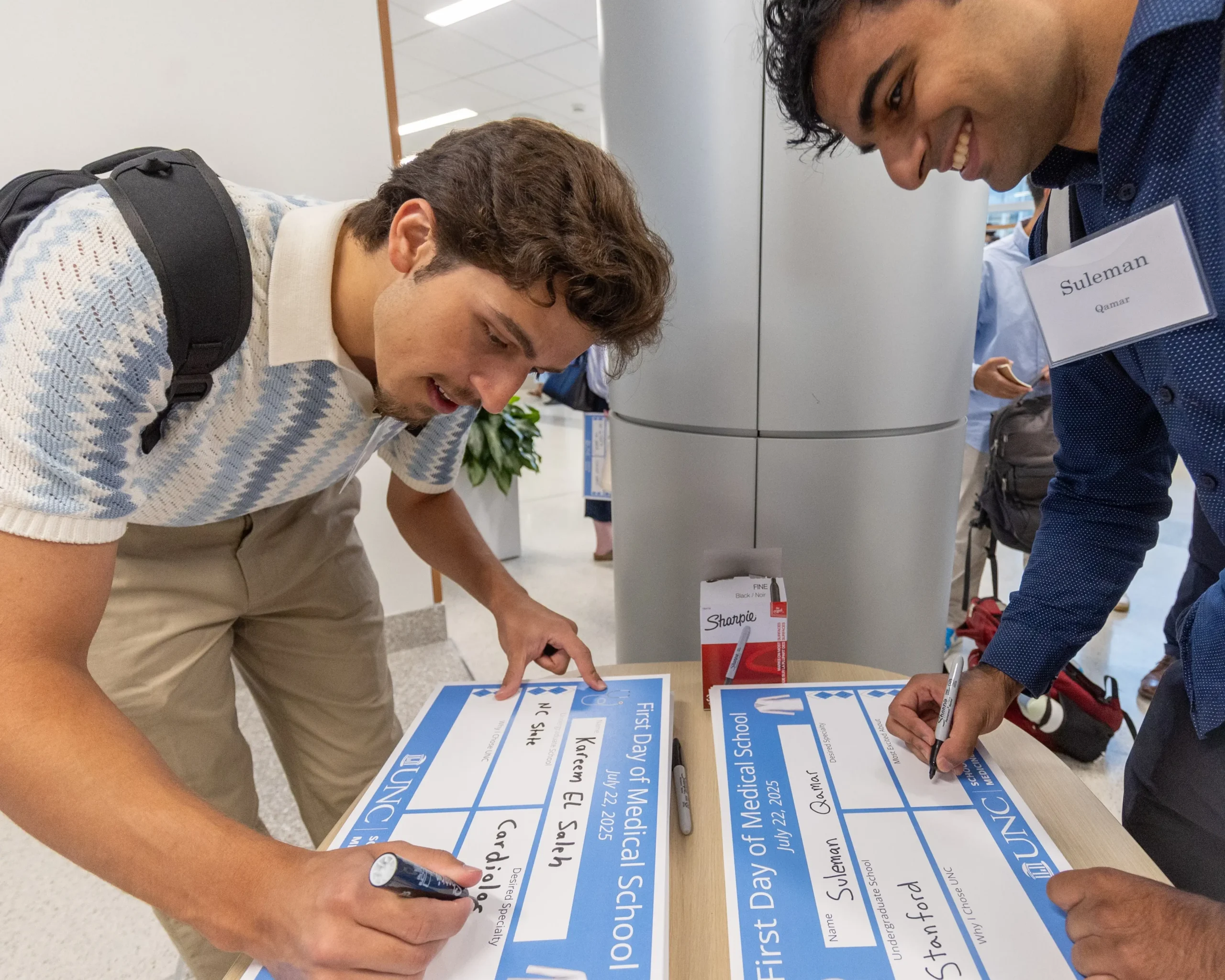 Medical students complete First Day of Medical School placards during an orientation event at UNC School of Medicine thanks to donors who chose to explore their giving options.