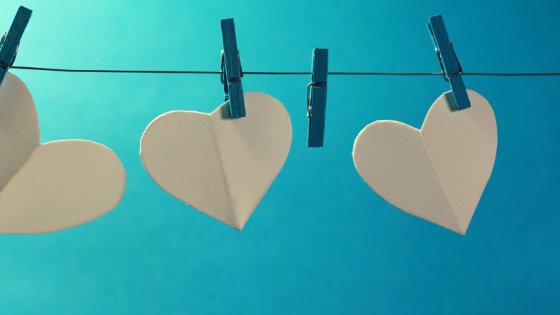 White hearts hung a line with clothespins