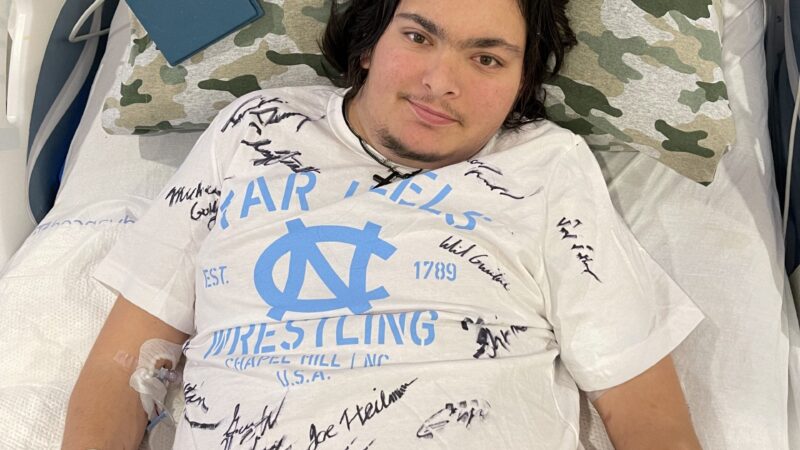 Tylor Morris shows off his signed t-shirt.