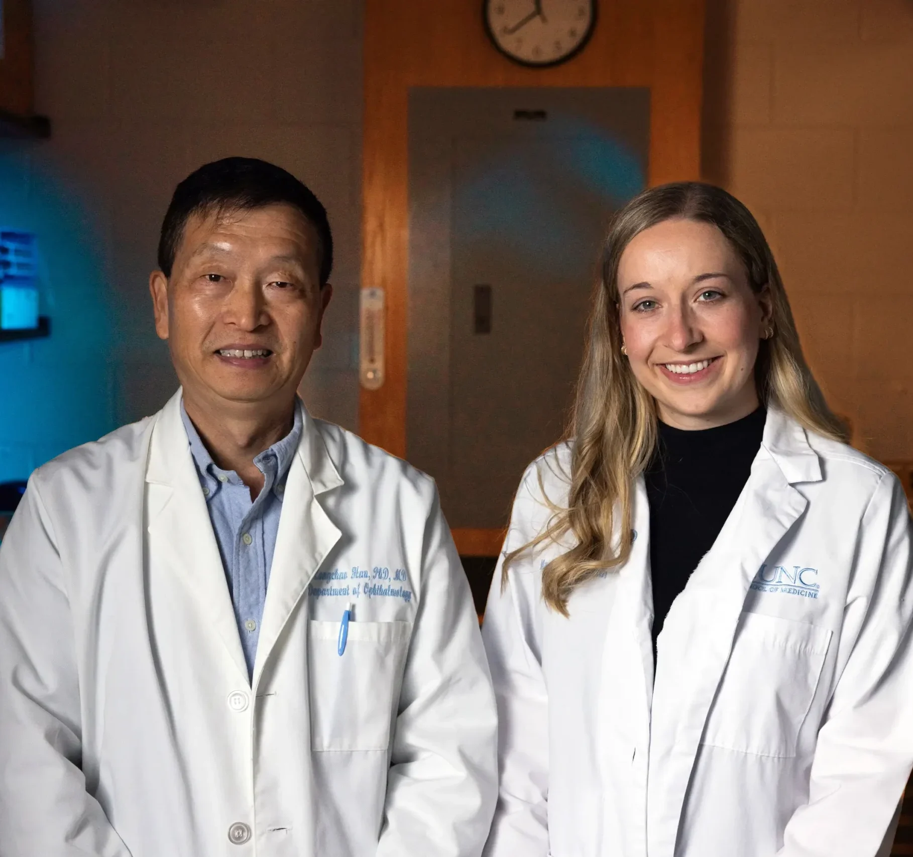 UNC research faculty member and medical student posing together in a research laboratory, highlighting the impact of healthcare philanthropy
