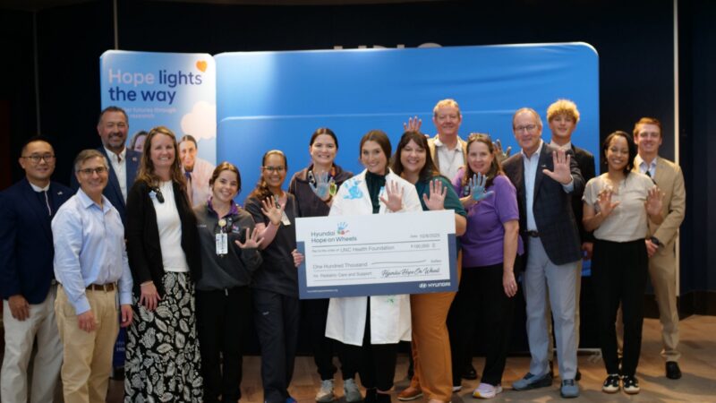 Check presentation featuring UNC Children's physicians and staff with Hyundai Hope on Wheels staff and patients