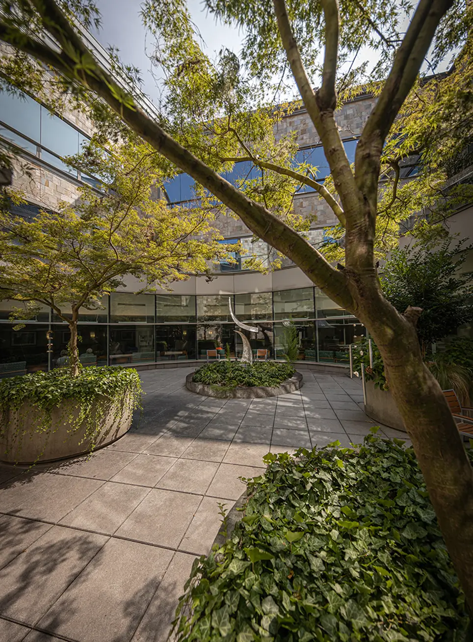 Exterior of a UNC healthcare building surrounding a landscaped courtyard symbolizing the impact of patient education, community outreach, and groundbreaking research made possible by hospital donations