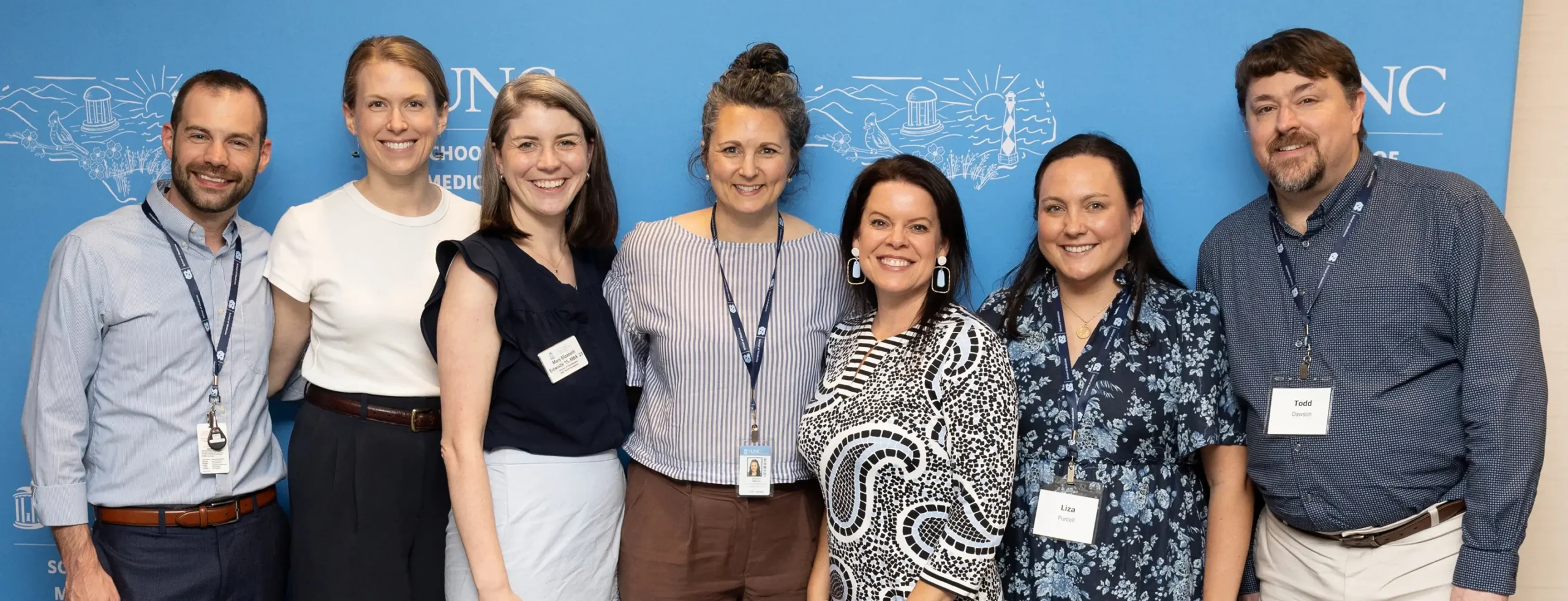 Group portrait of healthcare professionals and medical staff standing together after presenting rare disease research at a university medical event.