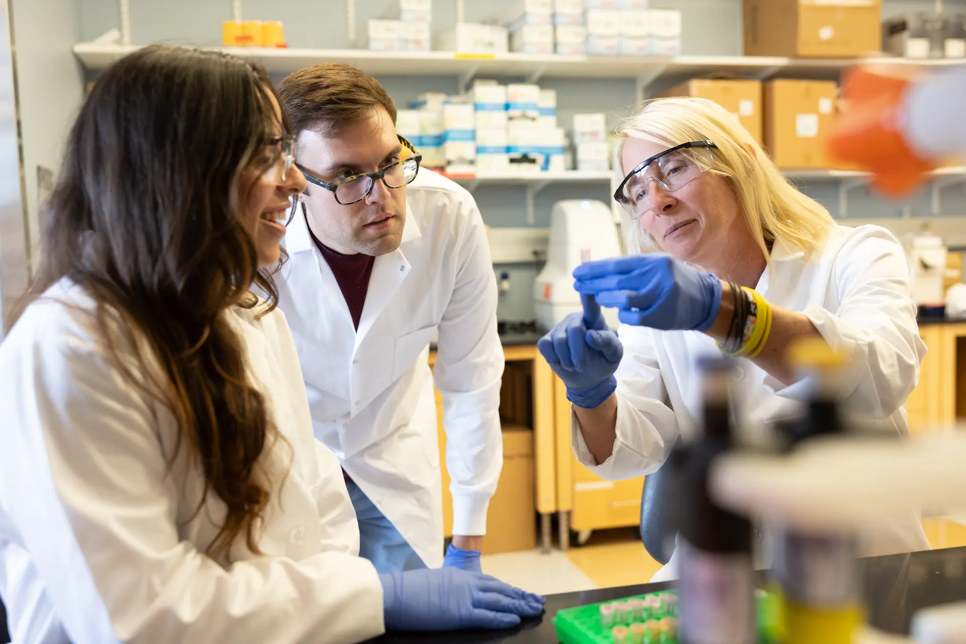 Three researchers in a UNC School of Medicine lab.
