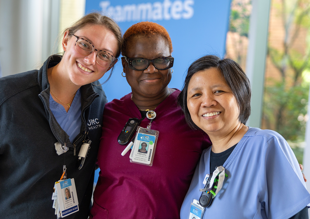Three UNC Health employees pose for a photo following a UNC Health Foundation fundraising event