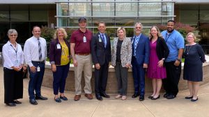 Group photo of UNC Health FoodWell working group outside N.C. Cancer Hospital