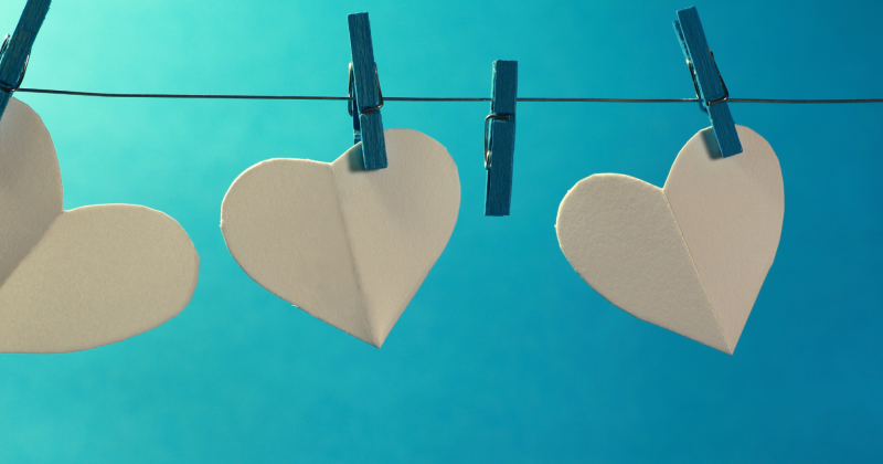 White hearts hung a line with clothespins