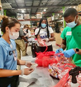 Kenan Urban Primary Care Scholars sorting food at the Food Bank of Central and Eastern NC