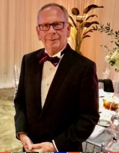 John Hammond, PhD, dressed in formal attire